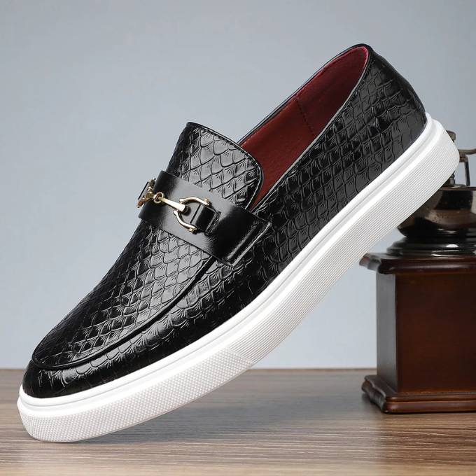Side view of men's sleek navy slip-on loafers, highlighting their modern silhouette and comfortable fit.