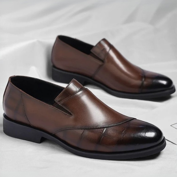 Modern men's casual slip-on loafers, combining comfort with urban footwear style for daily wear.