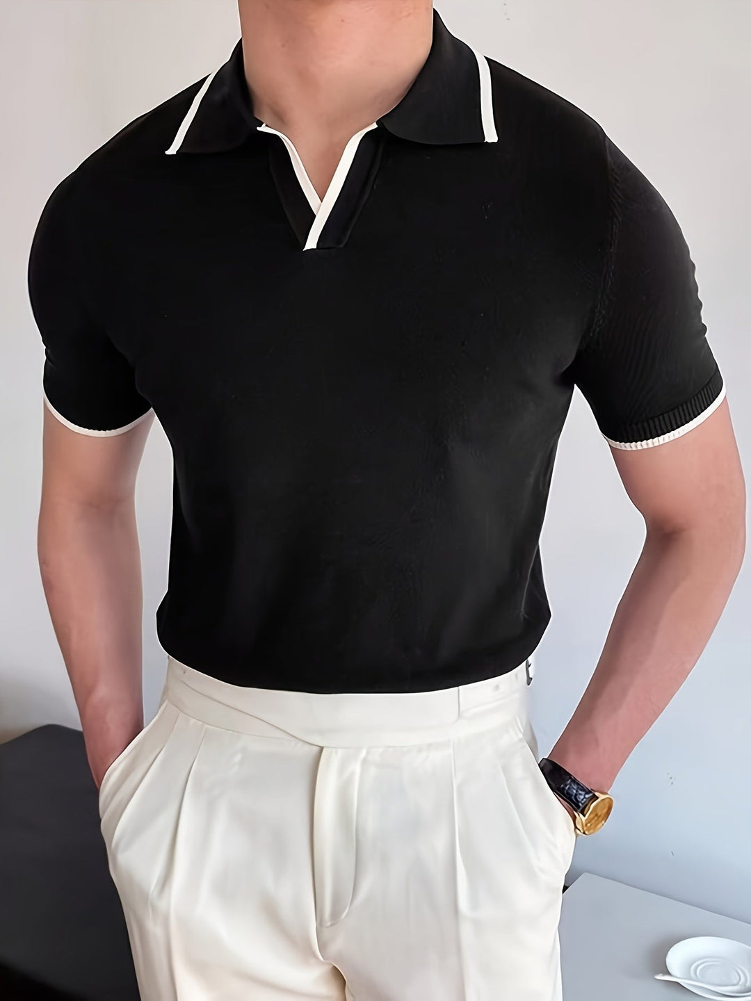 Men's modern black V-neck polo shirt with stylish contrast stripes, perfect for casual wear. Breathable and comfortable.