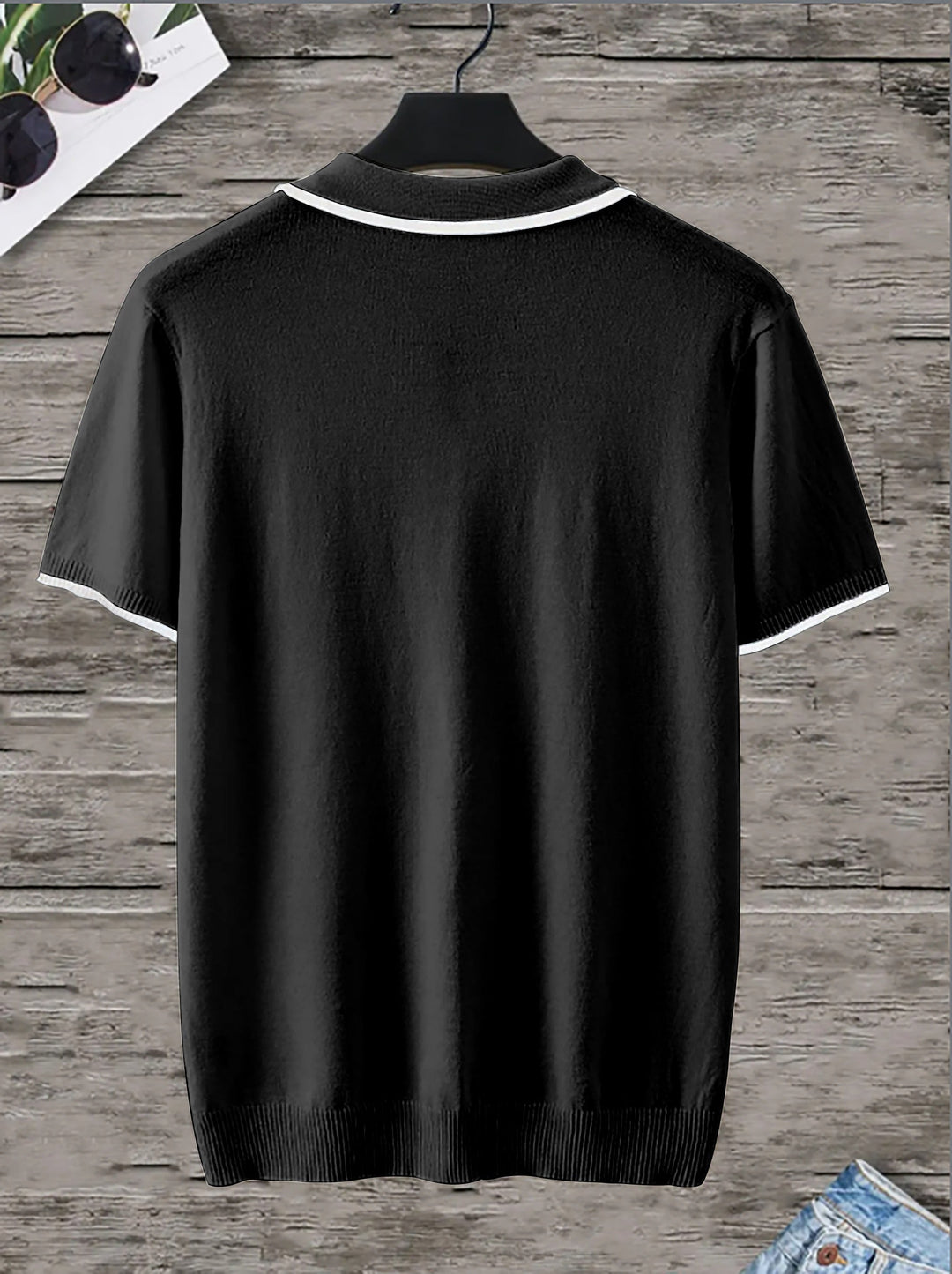 Comfortable men's V-neck polo in black with trendy contrast stripes. A breathable, modern short-sleeve casual shirt.