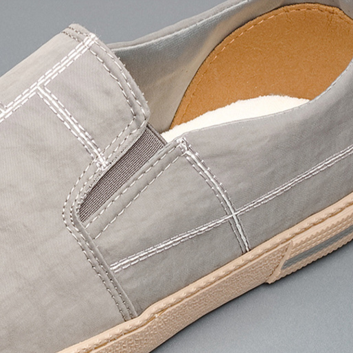 Breathable men's comfort slip-ons with a sleek, modern aesthetic, ideal for daily casual adventures.