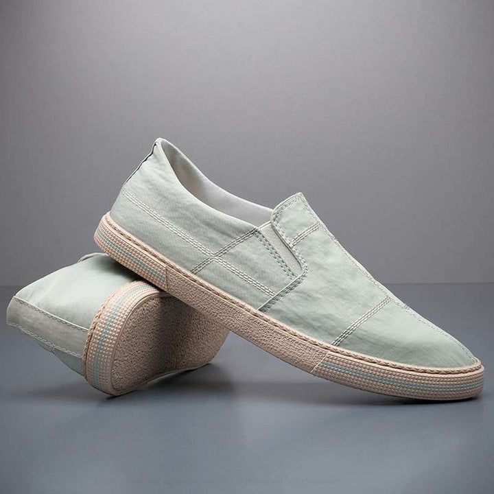 Lightweight men's walking shoes, slip-on style, providing modern comfort and a breathable design.