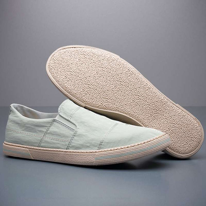 Casual men's slip-on shoes with a contemporary look, featuring comfort and lightweight construction.