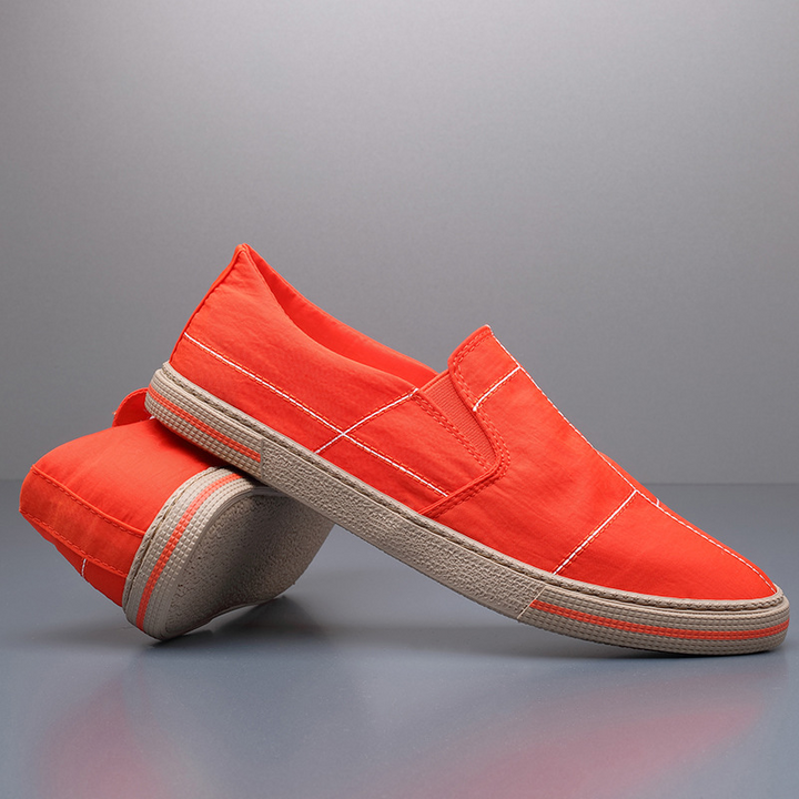 Men's black slip-on shoes, lightweight and breathable, offering superior comfort for casual and walking activities.
