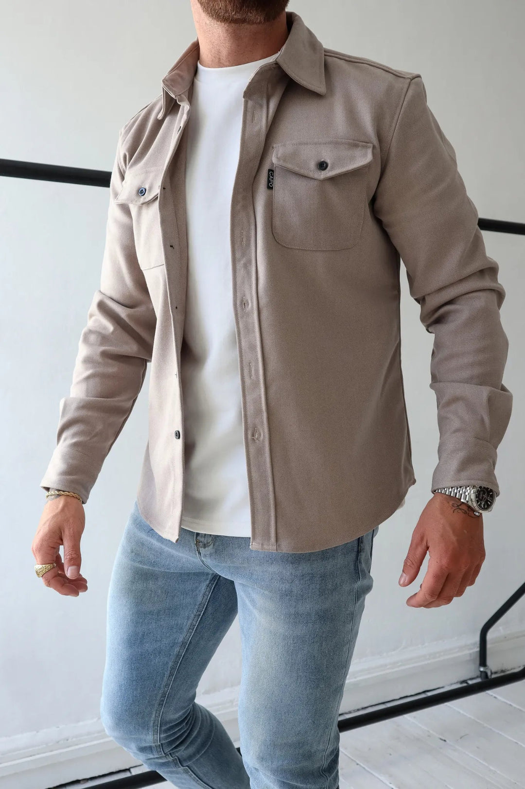 Detail shot of the Men's Elias shacket, highlighting fabric texture & button-down design. Modern casual jacket.
