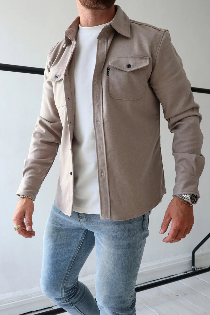 Detail shot of the Men's Elias shacket, highlighting fabric texture & button-down design. Modern casual jacket.