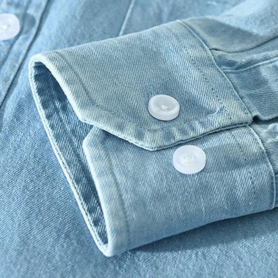 Detail of collar & buttons on a men's modern fit versatile denim shirt, showcasing quality & style.