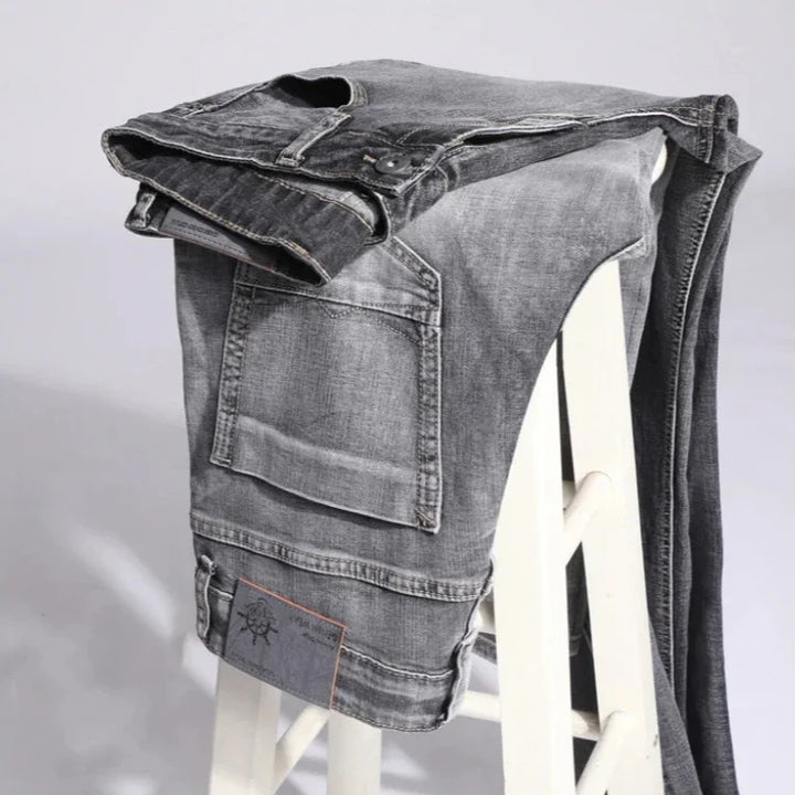Classic men's modern fit jeans, offering a sleek silhouette and comfortable feel for contemporary style.