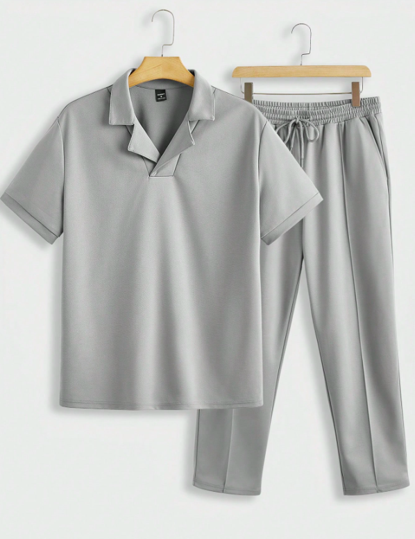 Comfortable men's two-piece grey summer outfit, showcasing a modern short-sleeved shirt and matching shorts.