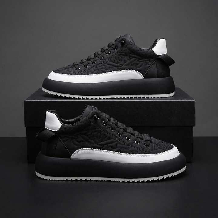 Comfortable men's lace-up sneakers with a modern aesthetic, perfect for active or casual outfits.