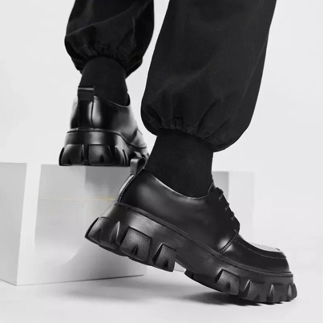 Men's smart casual footwear: low-top slip-on shoes with a distinctive thick sole for modern style.
