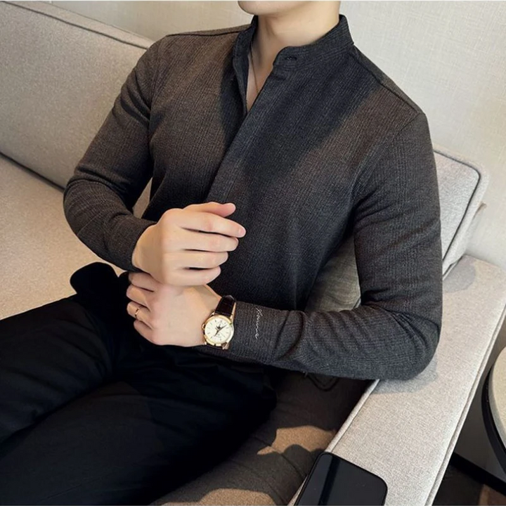 Tailored fit men's button-up shirt with mandarin collar, stretch fabric, great for smart casual or business apparel.