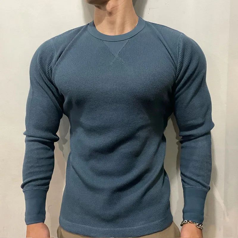 Fashionable men's muscle fit autumn sweater, slim fit long sleeve pullover for a contemporary fall look.