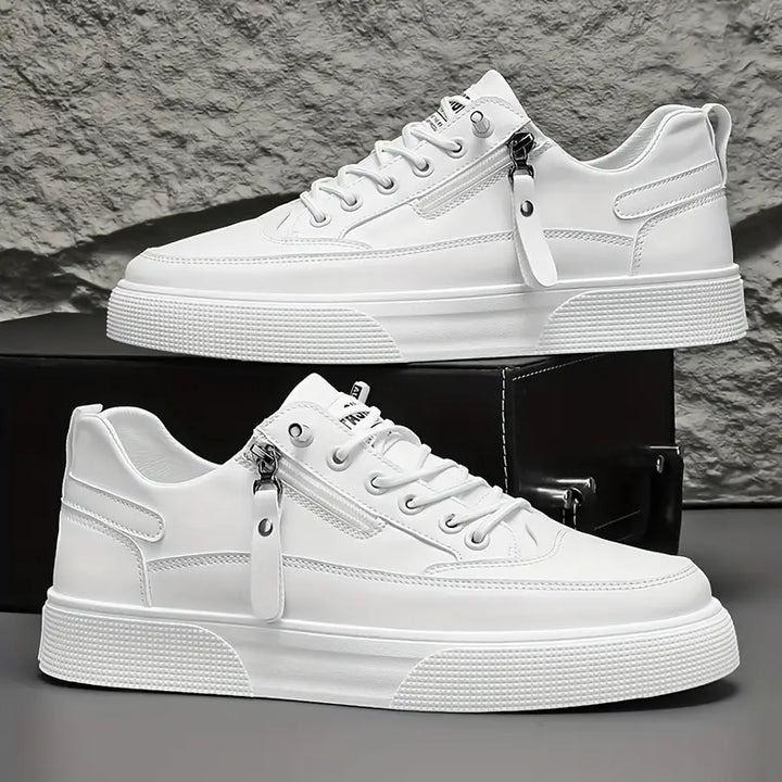 Crisp white men's side-zip sneakers, adding a stylish, modern touch to everyday outfits. Comfortable.
