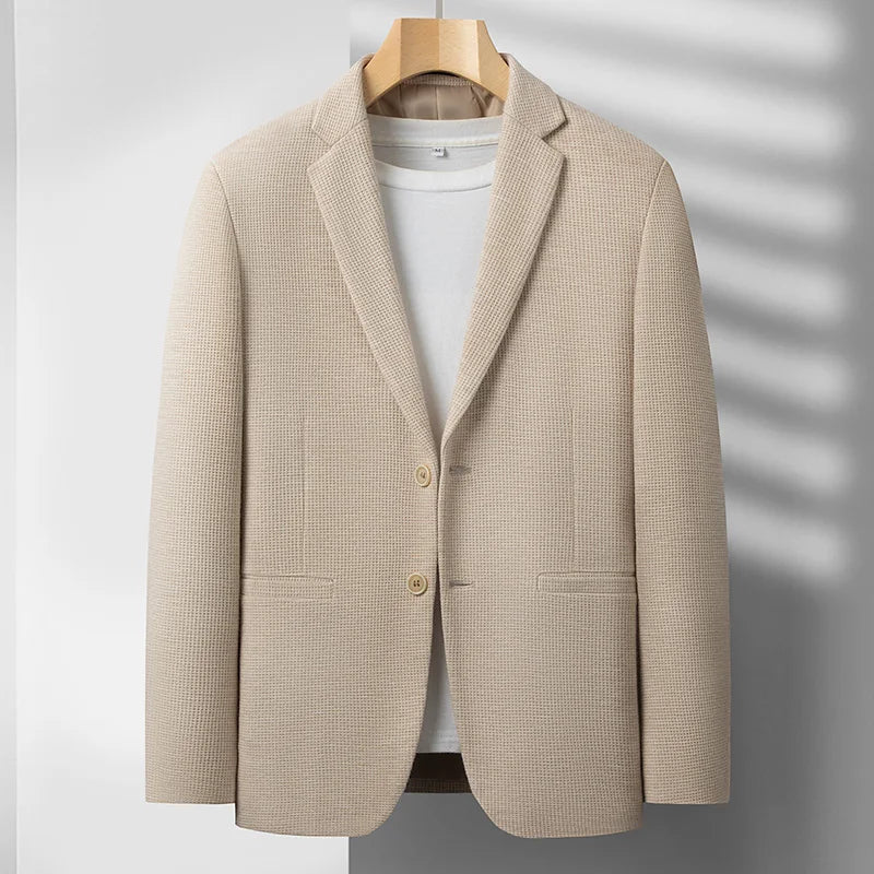 Stylish men's tailored fit blazer, ideal as a versatile modern jacket for business meetings or casual outings.