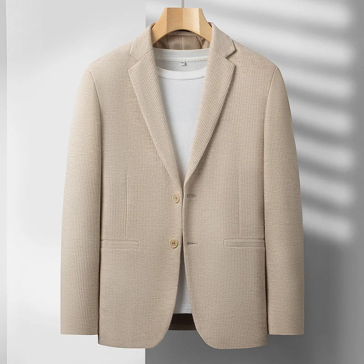 Stylish men's tailored fit blazer, ideal as a versatile modern jacket for business meetings or casual outings.