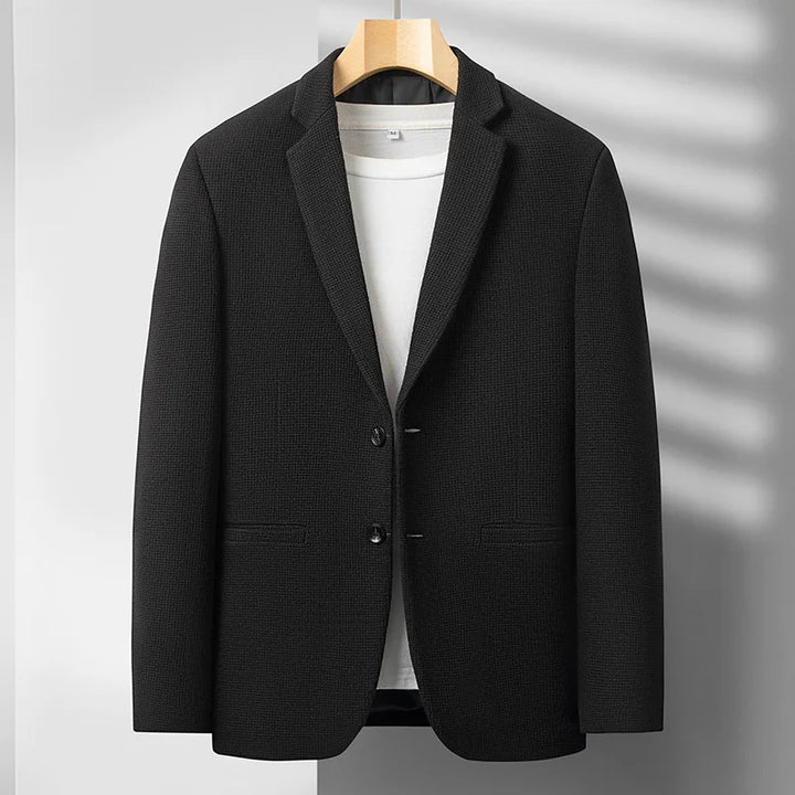 Modern men's outerwear: a tailored fit blazer jacket for a sharp formal look or sophisticated casual style.