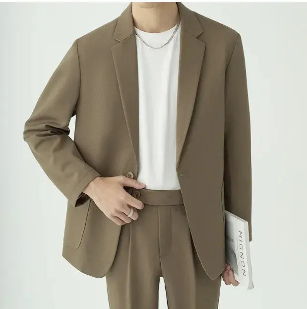 Men's modern tailored minimalist suit set for formal wear, perfect for business attire.