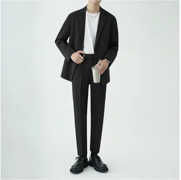 Sleek men's modern minimalist tailored suit, a two-piece set for sophisticated formal wear.