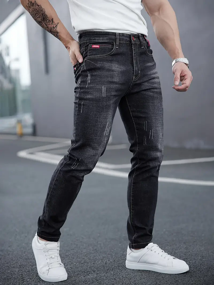 Men's modern tapered jeans, slim fit distressed denim. Perfect for casual wear & urban style.