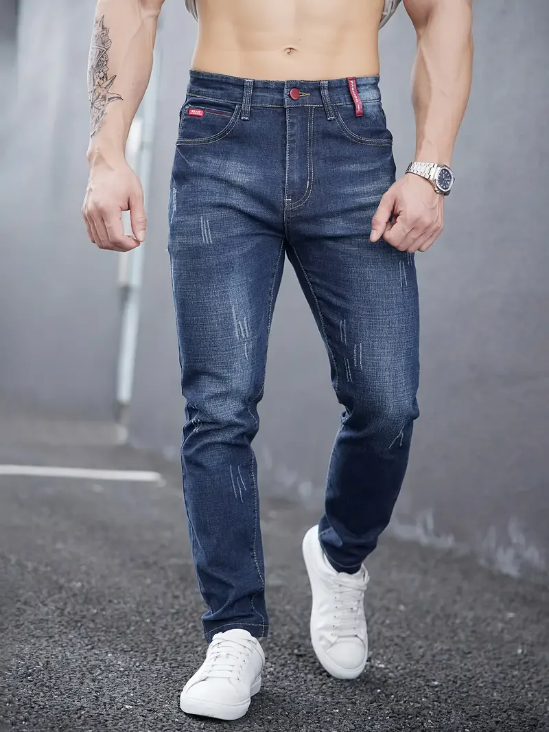 Men's modern slim fit tapered jeans. Distressed stretch denim for a stylish, comfortable casual look.