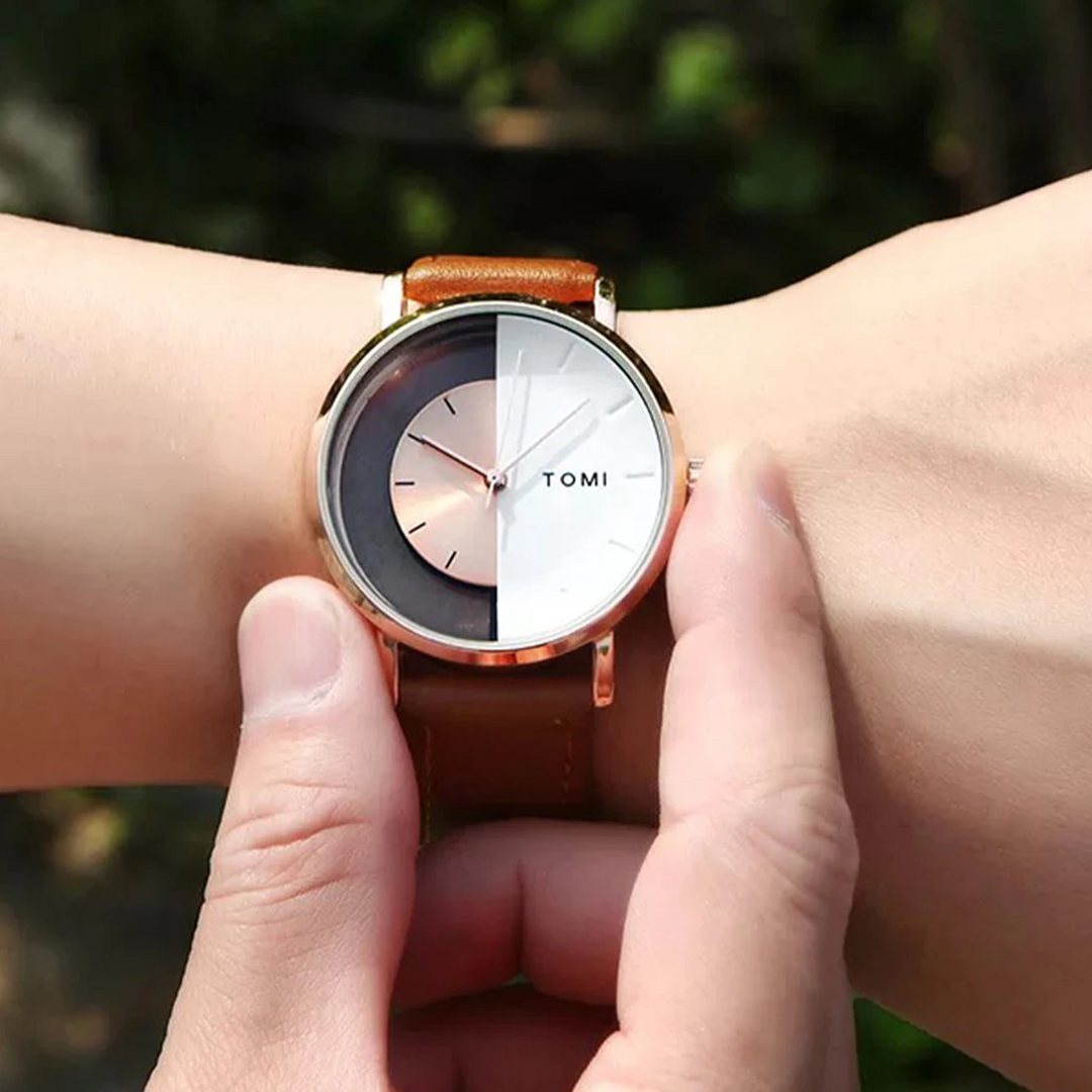 Elegant men's timepiece with a unique eclipse design dial and a luxurious genuine leather strap.