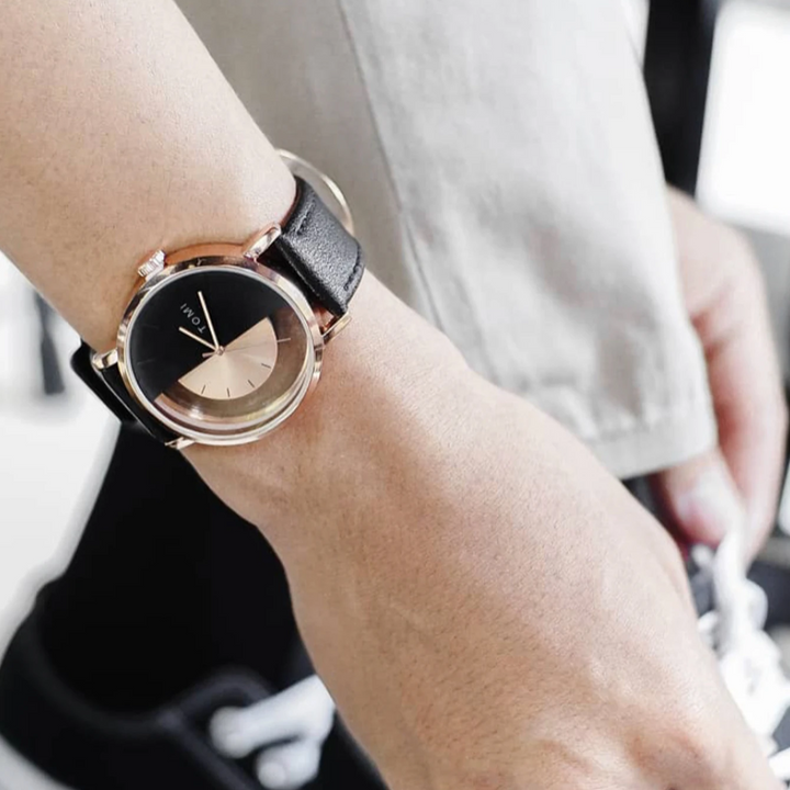 Men's contemporary watch with a striking eclipse design and durable genuine leather strap.