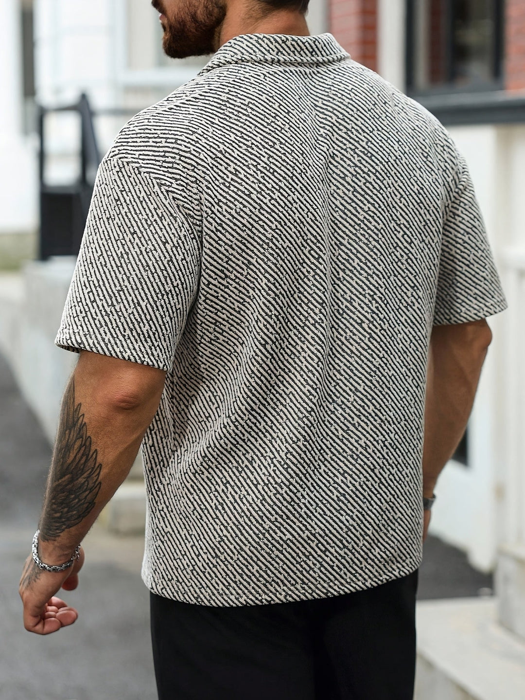 Stylish men's short sleeve textured polo shirt, perfect for warm weather & everyday comfort.