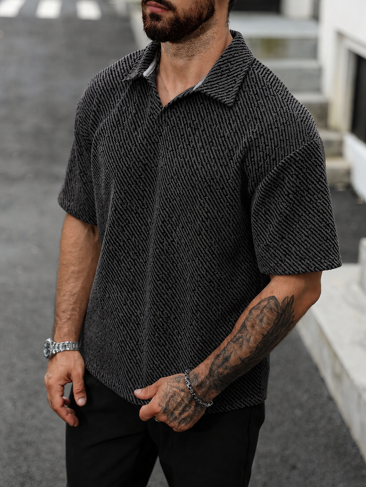 Stylish men's textured short sleeve polo shirt, comfortable for warm weather casual fashion.