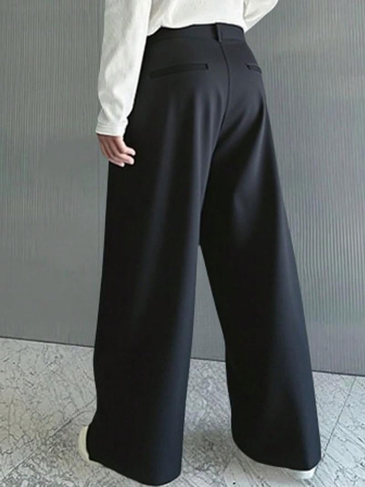 Modern men's wide leg trousers, Monaco style. Smart casual wool blend pants for contemporary men's fashion.
