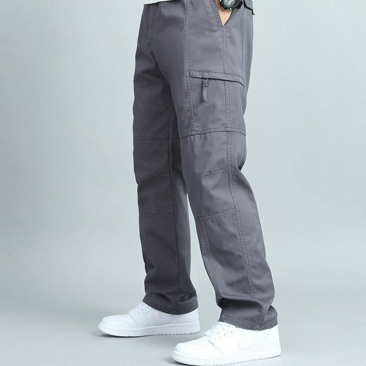 Side view of rugged men's cargo pants, designed for outdoor activities & heavy-duty workwear.