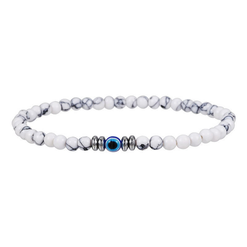 Men wearing natural stone evil eye adjustable protection bracelet. Spiritual gemstone accessory.