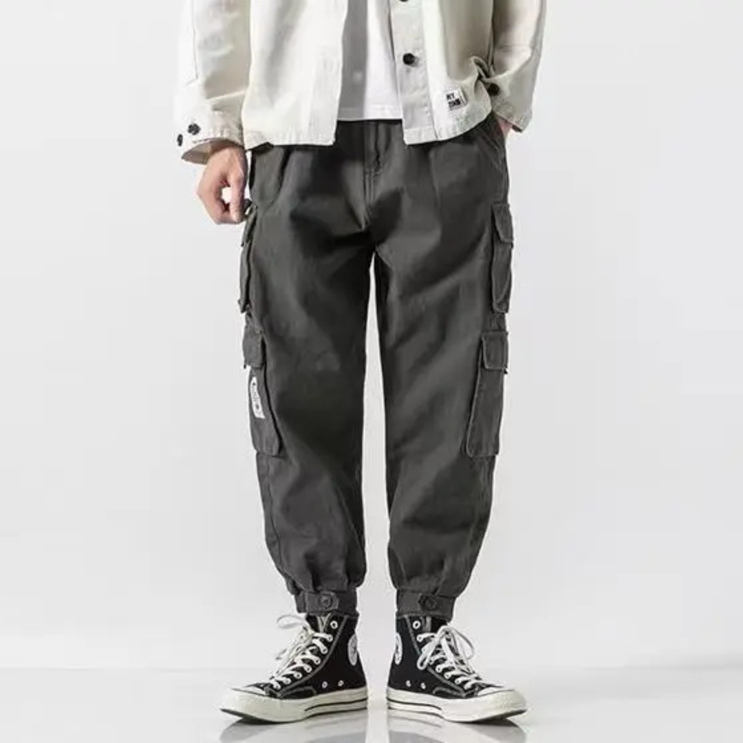 Close-up of durable utility pockets on men's heavyweight cargo joggers, tapered & comfortable.