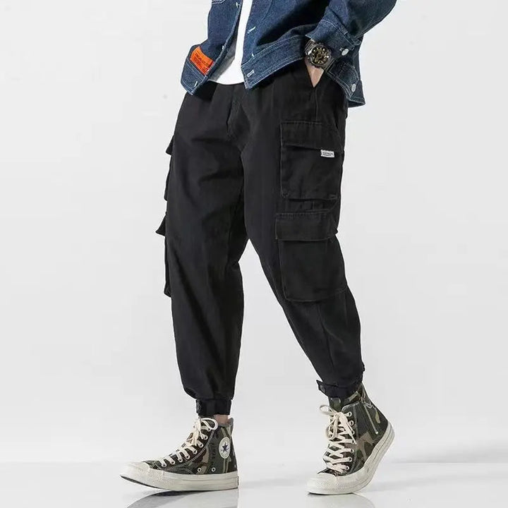 Heavyweight men's cargo jogger pants, offering durable utility, tapered fit, and ultimate casual comfort.