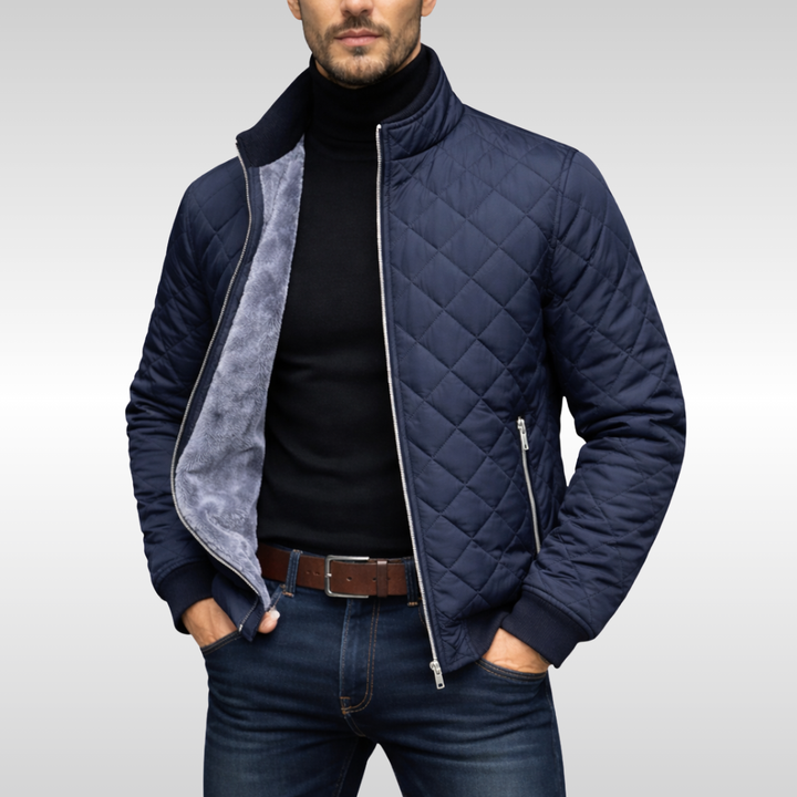 Men's navy blue quilted jacket, providing versatile warmth for fall and winter. Lightweight casual outerwear.