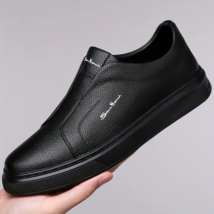 Men's stylish white slip-on sneakers, combining everyday comfort with a sleek, modern look.
