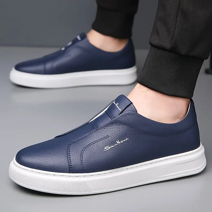 White men's Shoreline slip-on sneakers, versatile & comfortable footwear for everyday style.