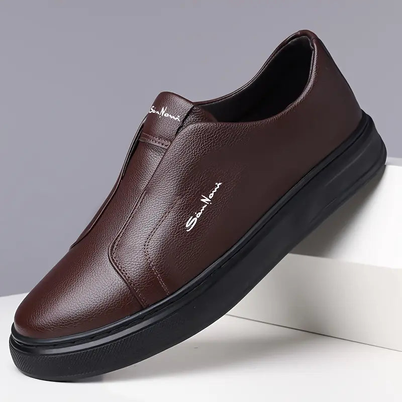 Black men's slip-on sneakers, a comfortable, stylish casual shoe with reliable traction.