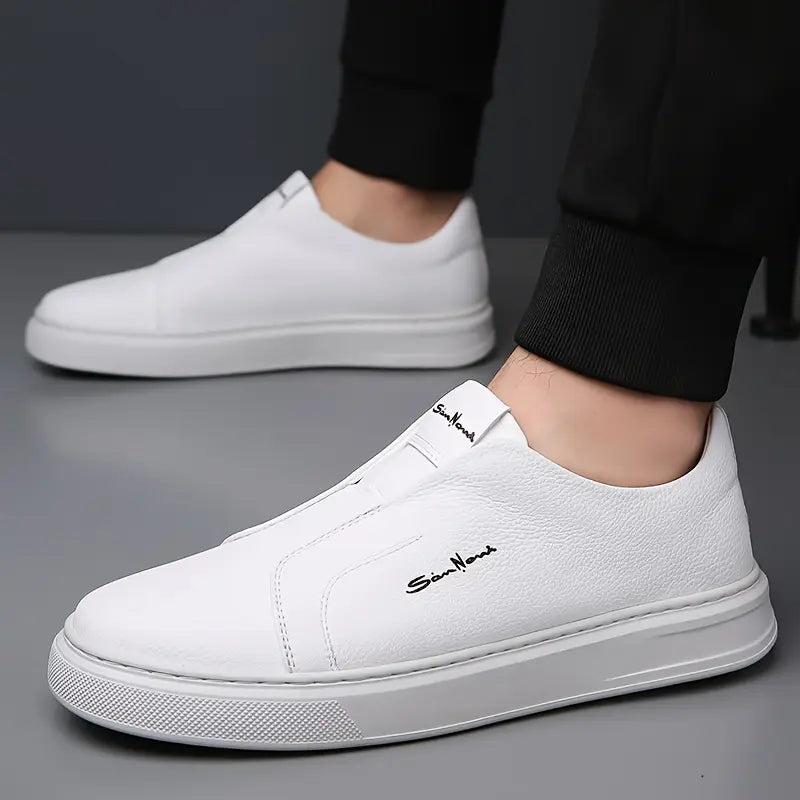 Men's comfortable navy blue slip-on sneakers, ideal casual footwear for effortless style.