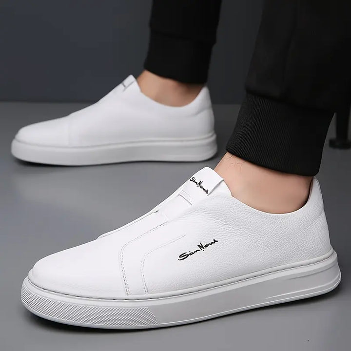 Men's comfortable navy blue slip-on sneakers, ideal casual footwear for effortless style.