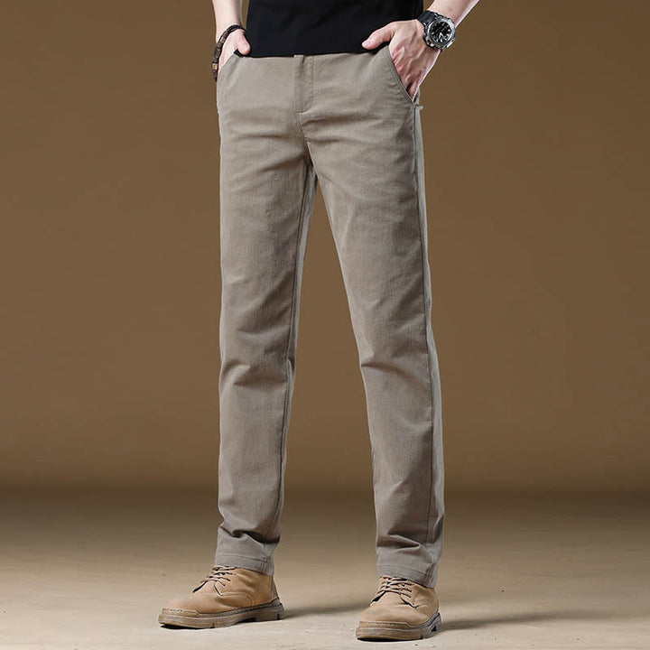 Slim fit men's tailored pants in navy, ideal for professional office wear or business casual. Wrinkle-resistant dress pants.