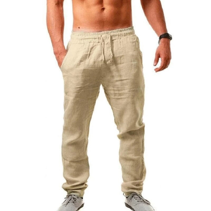 Close-up of lightweight men's linen trousers in a natural weave, offering ultimate summer breathability.