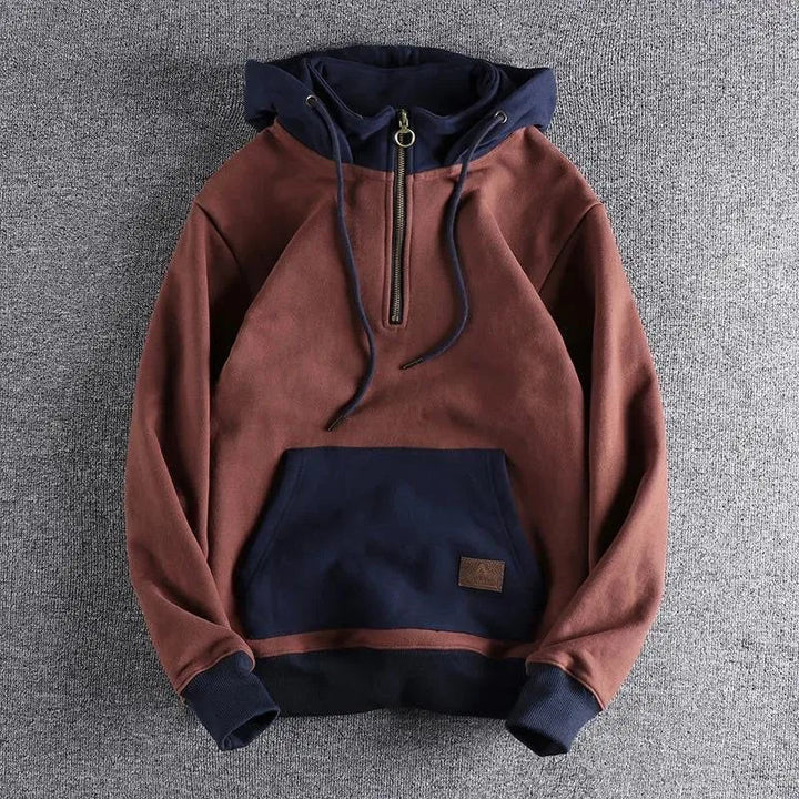Men's Nomad quarter-zip hoodie. Urban explorer outerwear, comfortable and durable for everyday casual wear.