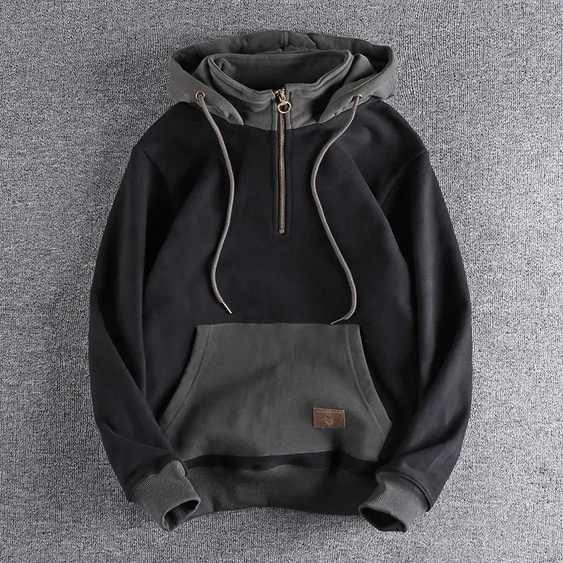Modern men's quarter-zip hoodie, two-tone design for urban explorer fashion. Comfortable, durable casual wear.