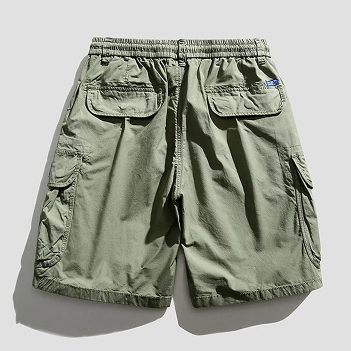Northbay utility shorts for men, featuring multiple pockets & relaxed fit for outdoor attire.