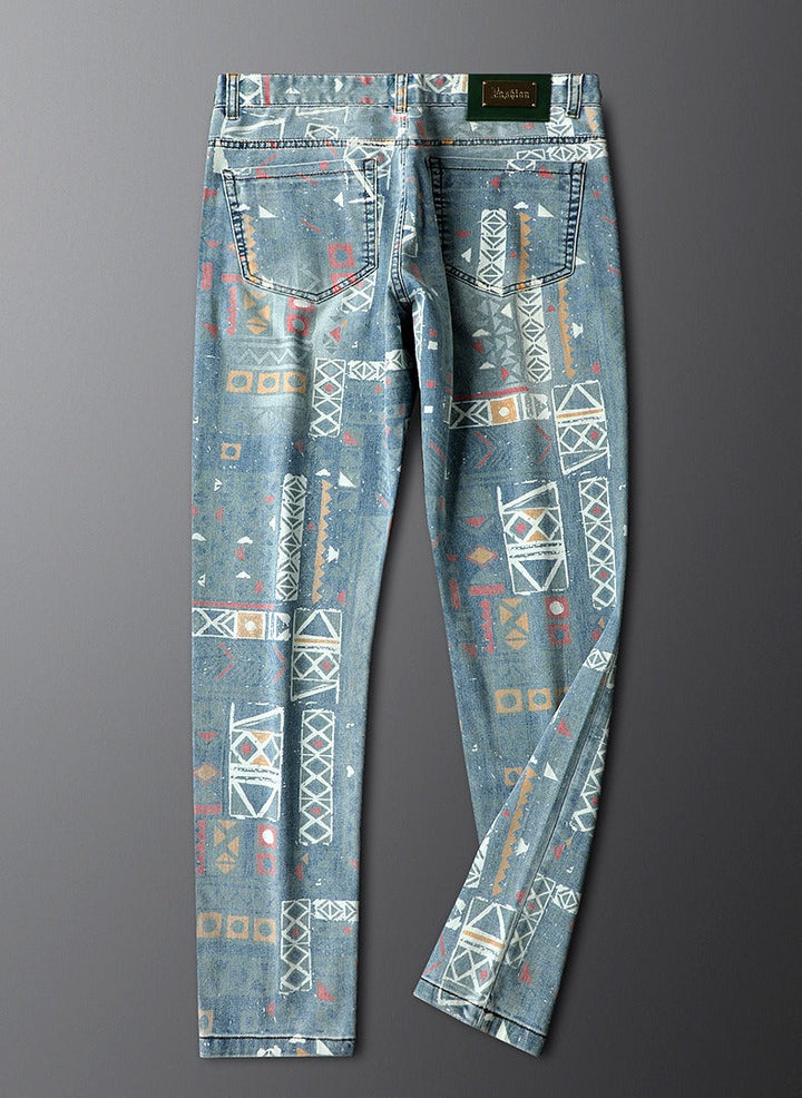 Close-up: men's slim fit patterned jeans, highlighting bold fabric & modern design details.
