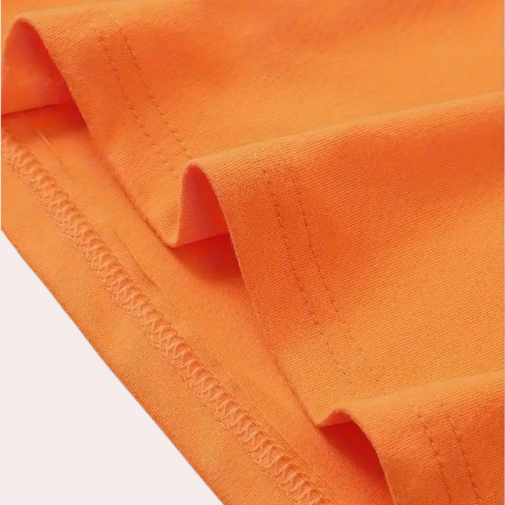 Vibrant orange men's t-shirt with classic round neck design, made from soft cotton blend.
