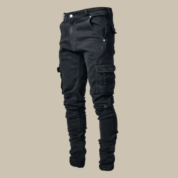 Black men's Orion stretch cargo jeans with spacious pockets, combining style, comfort, and functionality.