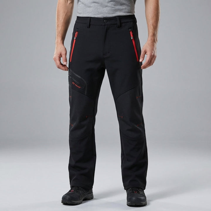 Close-up of men's stretch outdoor winter trousers in black, showing waterproof fabric and durable stitching