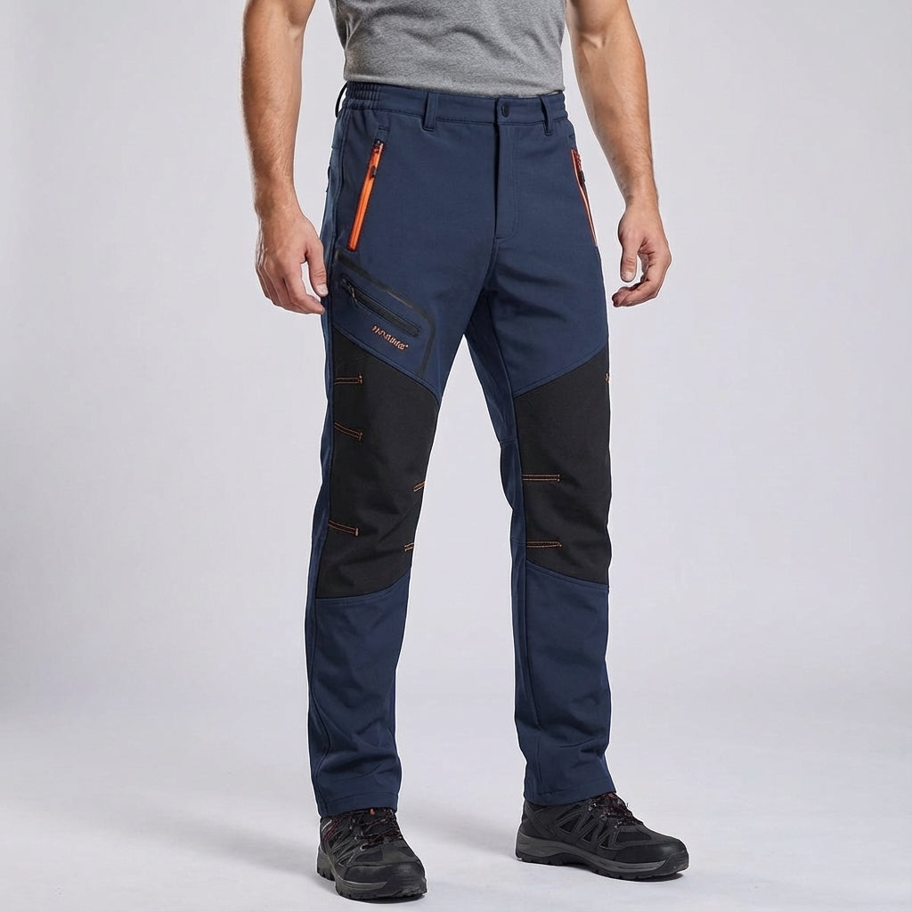 Side view of men's black waterproof winter sports trousers, designed for freedom of movement